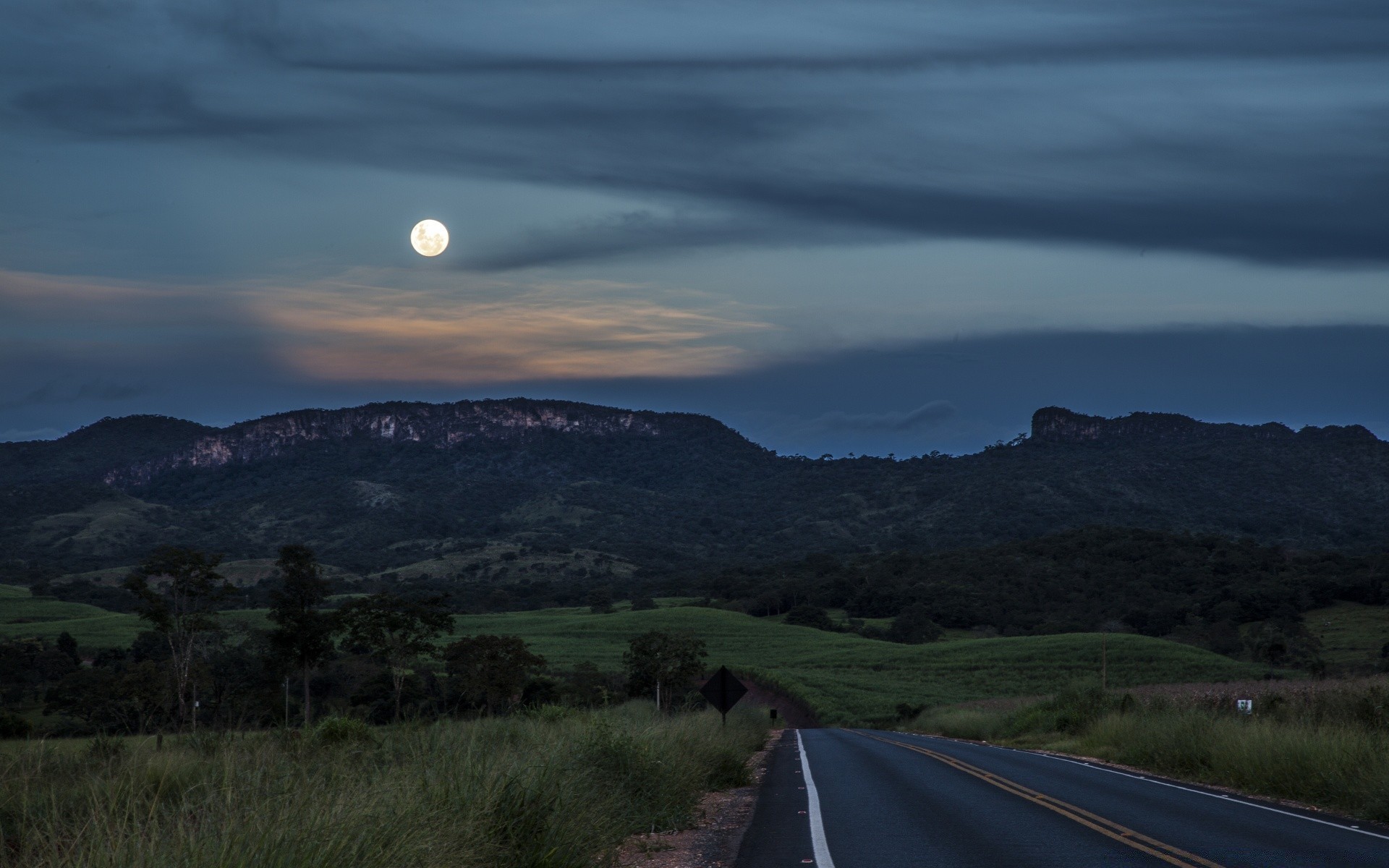 america landscape travel road sky mountain outdoors nature sunset tree daylight countryside hill highway grass dawn cropland