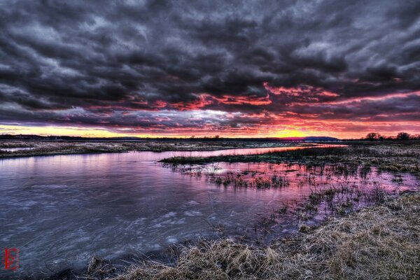 Large storm clouds spread out in the twilight