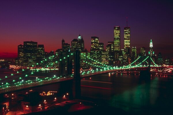 Illuminated bridge on the background of the night city