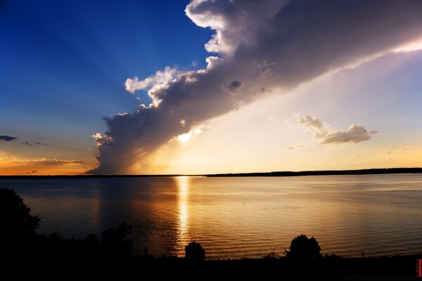 Sunset on the beach with a divided sky