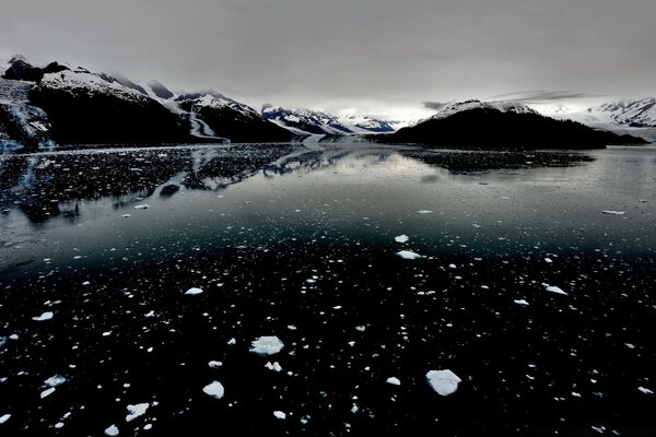 The freezing waters of a dark mountain lake