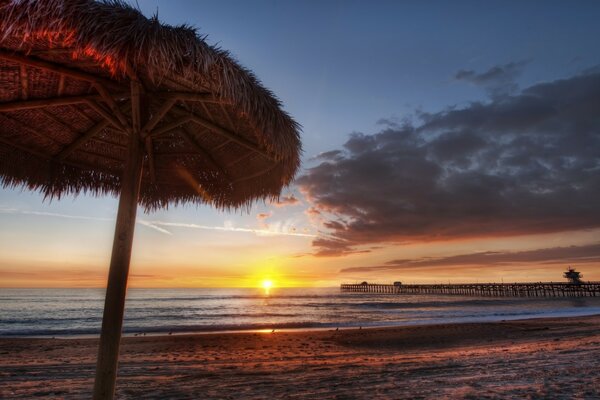 Sunset on the shore of the mysterious ocean