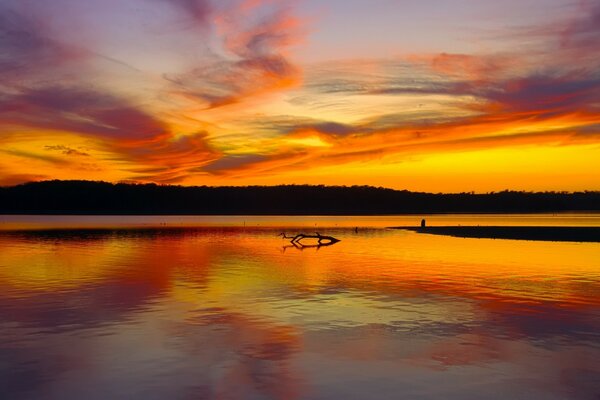 Scarlet sunset on the background of water