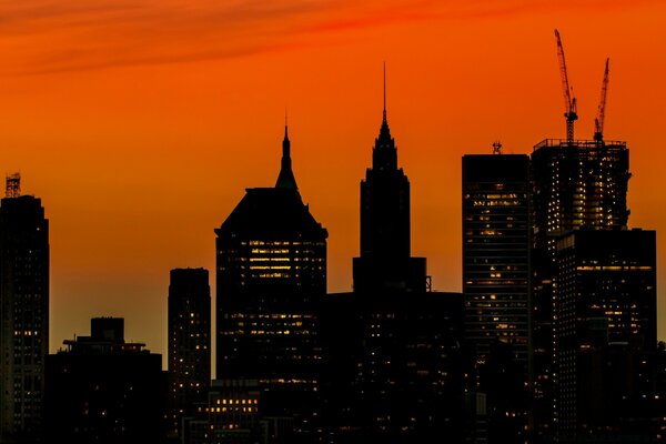 Skyscrapers against the orange sky