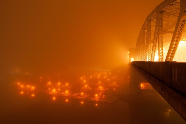 Misty dawn on a metal bridge