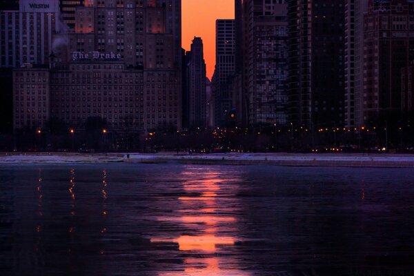 Sunset on the ocean and high-rise buildings