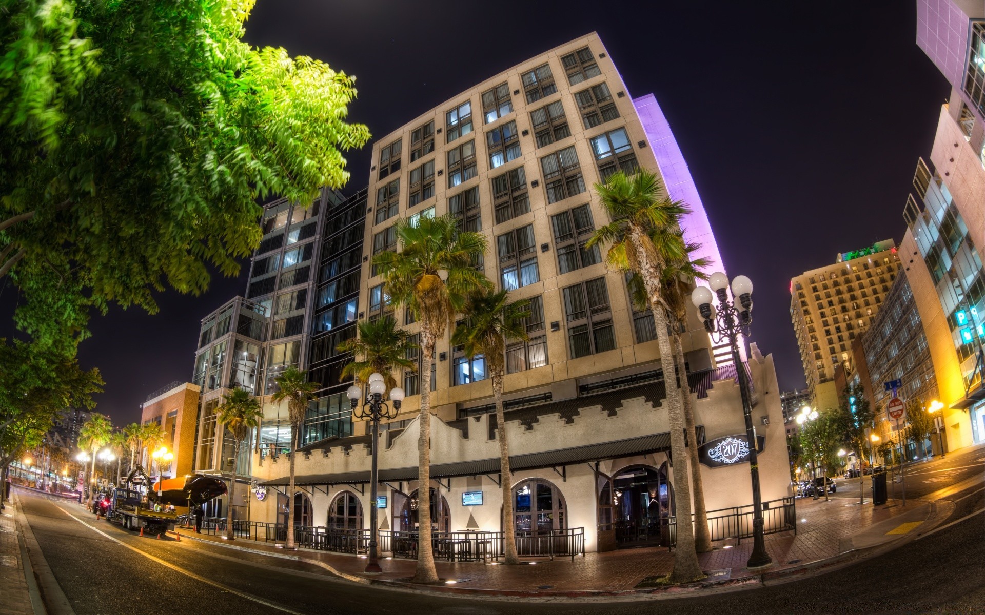 america street city travel road building architecture urban traffic downtown evening illuminated car light dusk transportation system modern cityscape bus blur