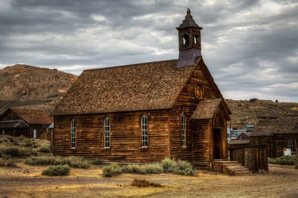 An old church on the background of hills