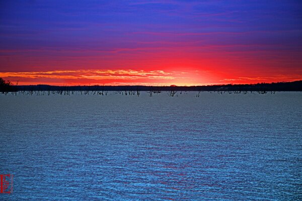 Amazingly beautiful sunset on the background of water