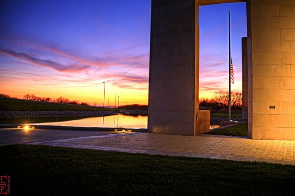 Landscape of the sky at sunset with an American flag