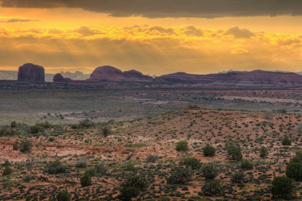 A gorgeous landscape of the sky over the hills in the desert