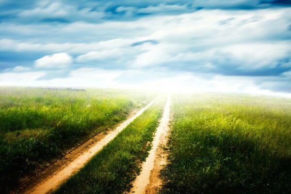 Rural road in the field blue sky fog