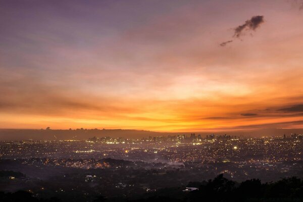 Orange dawn over an Asian city