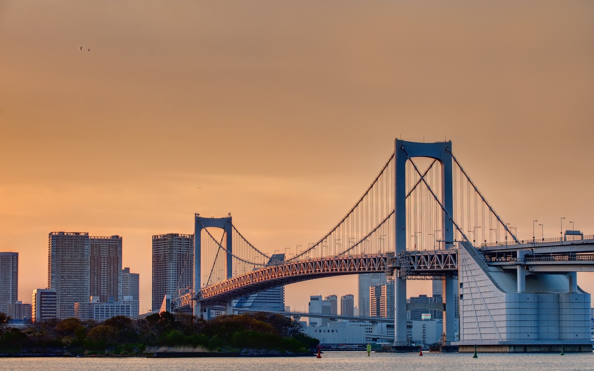 asia bridge architecture city river water suspension bridge travel sky sunset building transportation system downtown skyline dusk cityscape urban evening connection modern