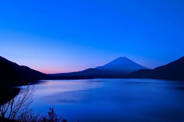 Evening sunset over the mountains on the river