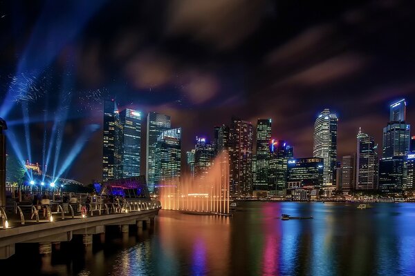 City skyscrapers in the light of blue spotlights