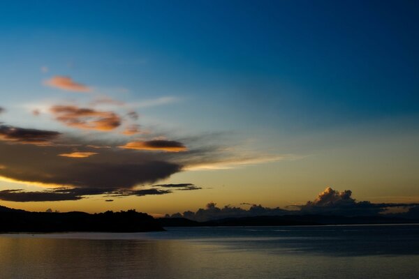 Cumulus clouds against a turquoise sky