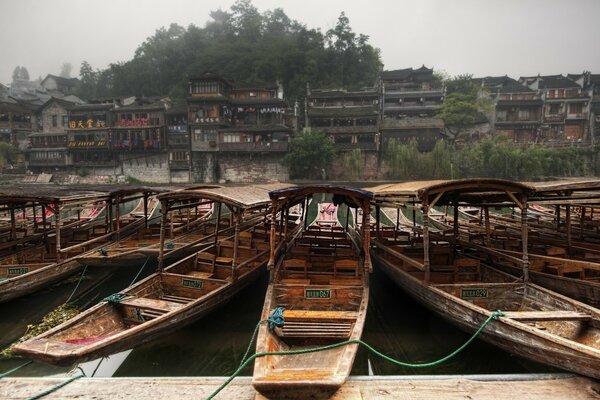 Quiet pier with lonely wooden boats