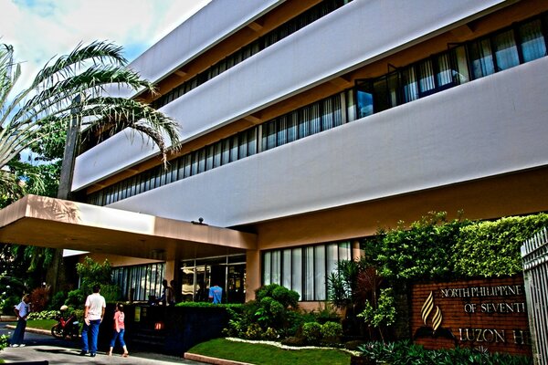 Modern architectural hotel near the palm tree