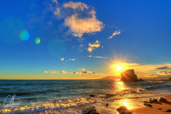 IL TRAMONTO VA IN MARE SULLA RIVA