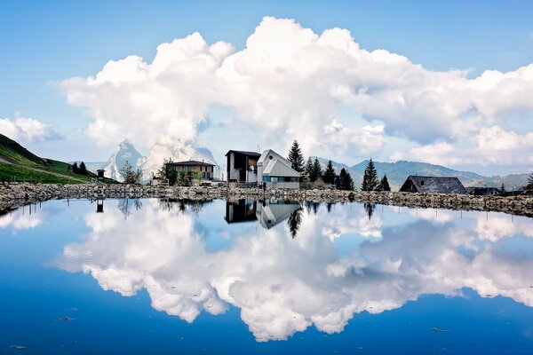 Reflection of clouds in a mountain lake nature