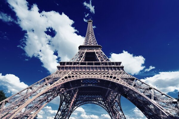 View of the Eiffel Tower from below against the sky