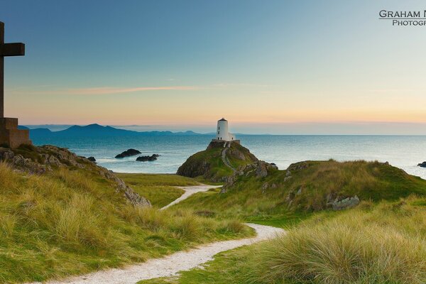 Lighthouse on the ocean . The place of death of sailors