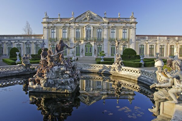 Beautiful fountain in the park near the house