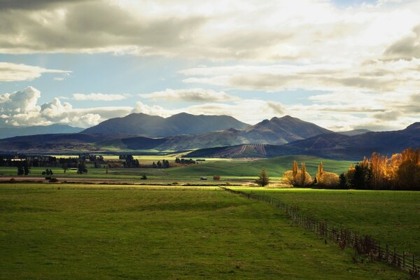 Mountains in the sky. Endless green meadows