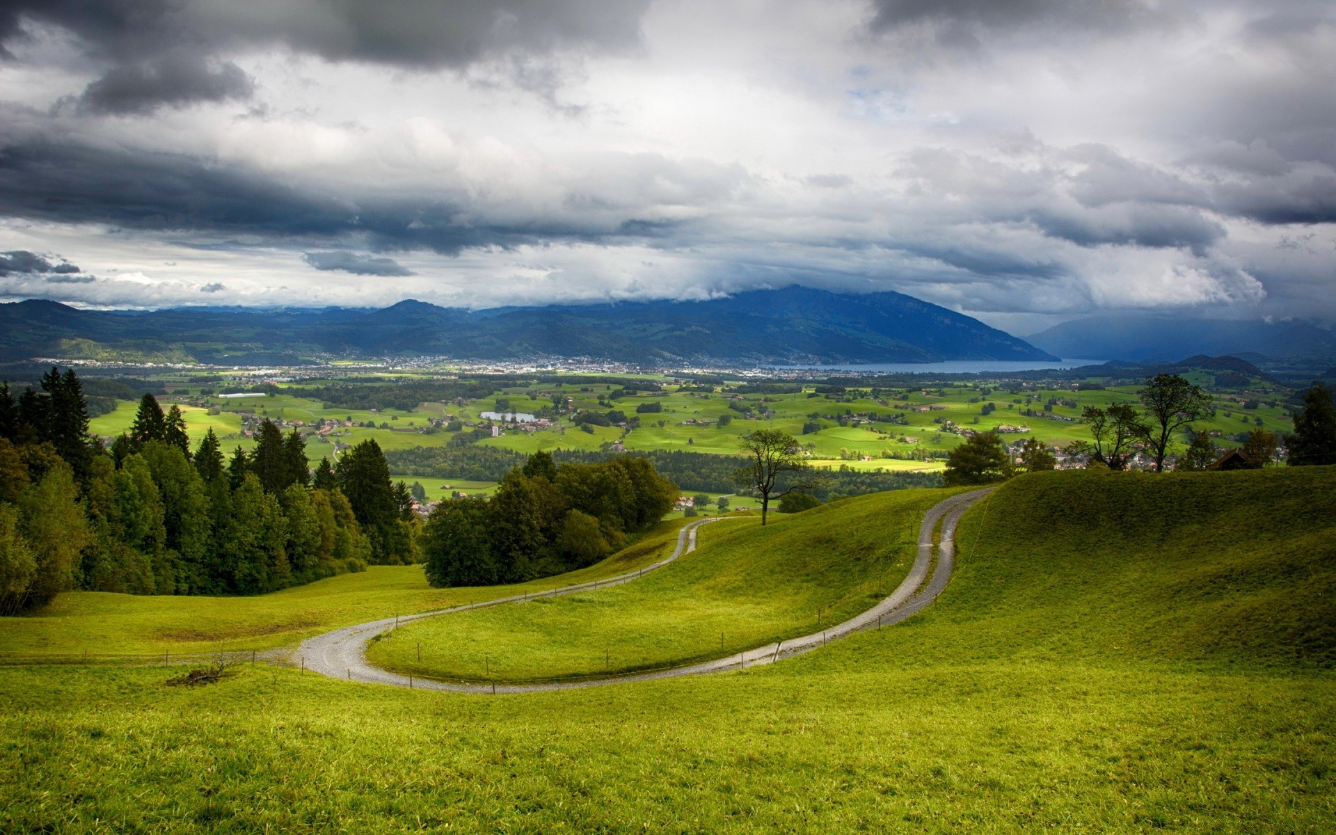 europe landscape grass nature sky countryside tree hill rural hayfield field scenic travel outdoors road country summer agriculture grassland cloud