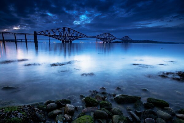 Beautiful night ocean under the bridge