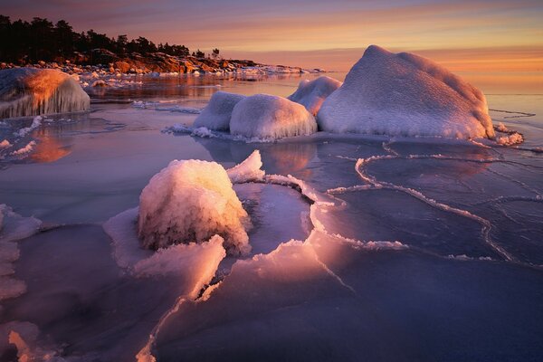 Frozen sea on the background of sunset