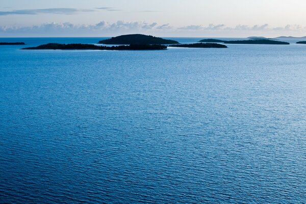 Distant islands in the water expanses