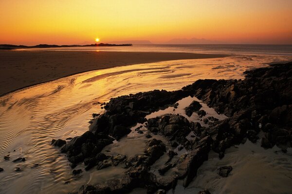 Orange bright sunset on the beach