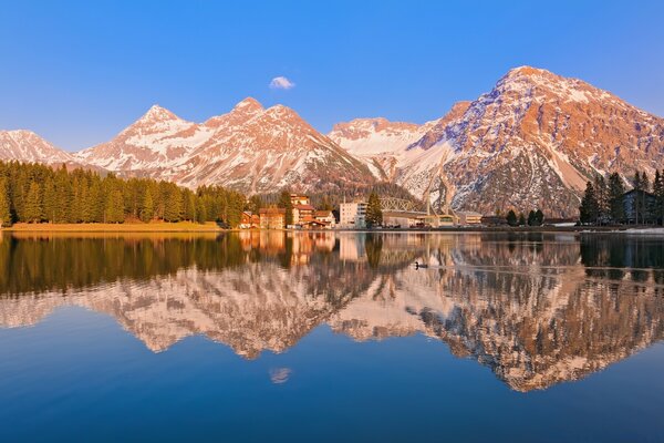 High mountains and like a mirror a mountain lake