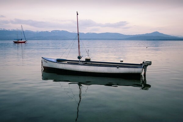 Calm and sailboat. Foggy morning