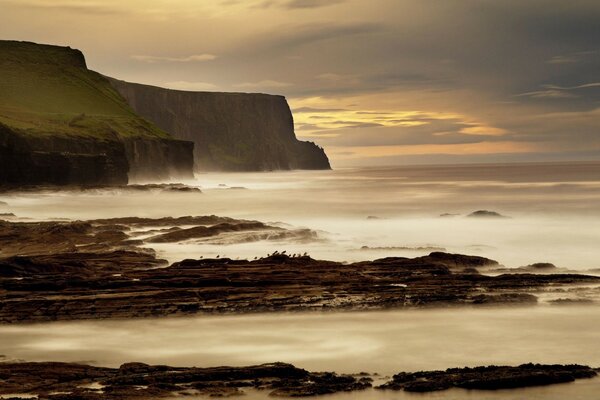 Sunset at the rocky shore