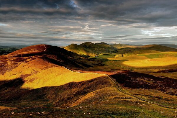 Clouds cast amazing shadows on the hills