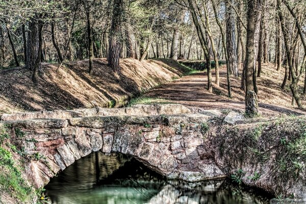 An old stone bridge across the river