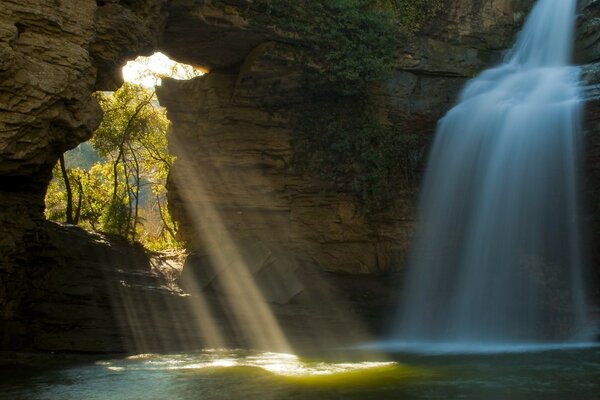 Waterfall in a dark cave in Europe