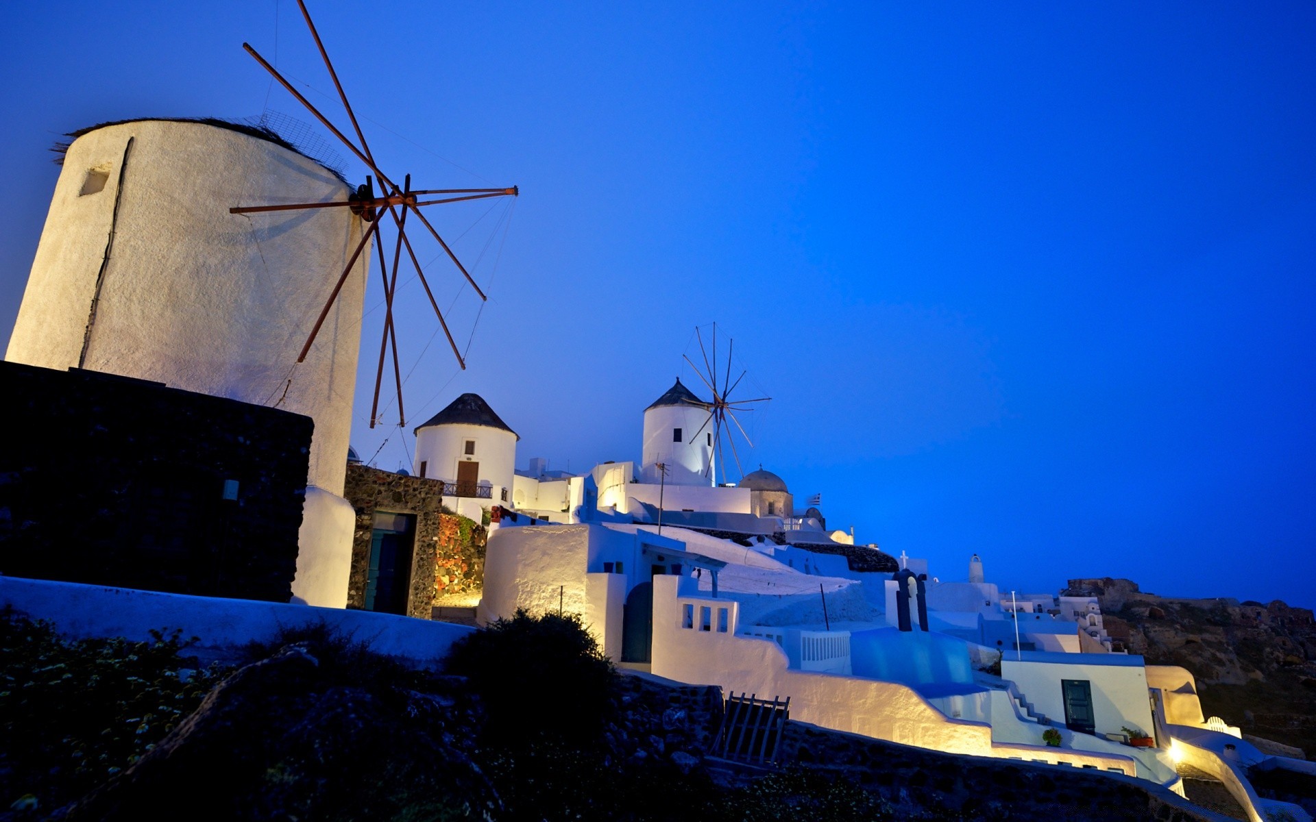 europe windmill sky travel outdoors architecture landscape evening building sea sunset grinder water seashore tower dusk energy tourism house city