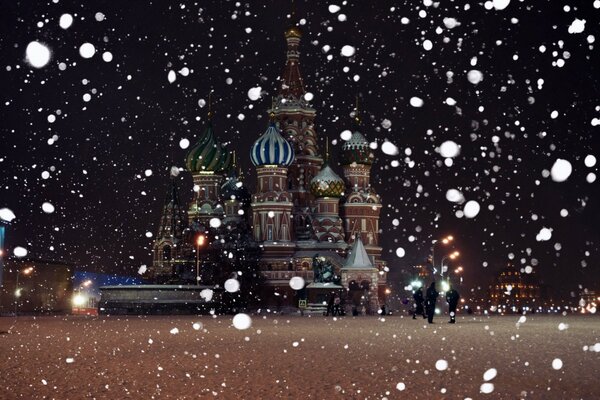 Snow on the background of the temple in Moscow