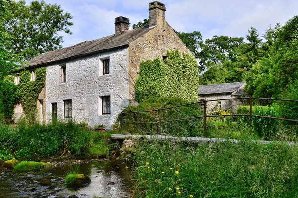 An old house surrounded by greenery