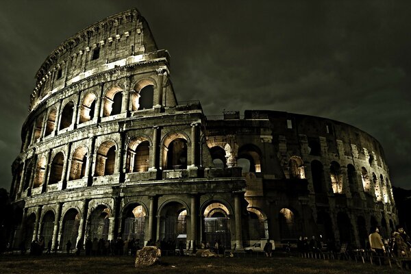 Ancient Colosseum against a gray sky