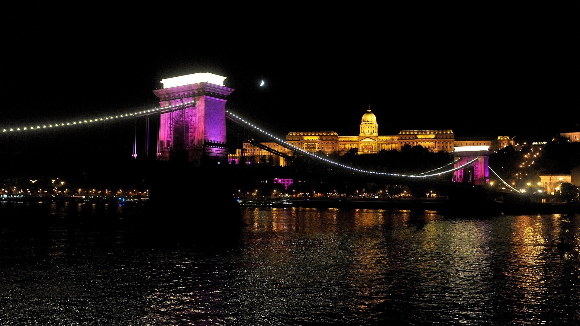 europe water bridge travel city river architecture dusk evening light cityscape building reflection sky sunset urban transportation system landmark downtown