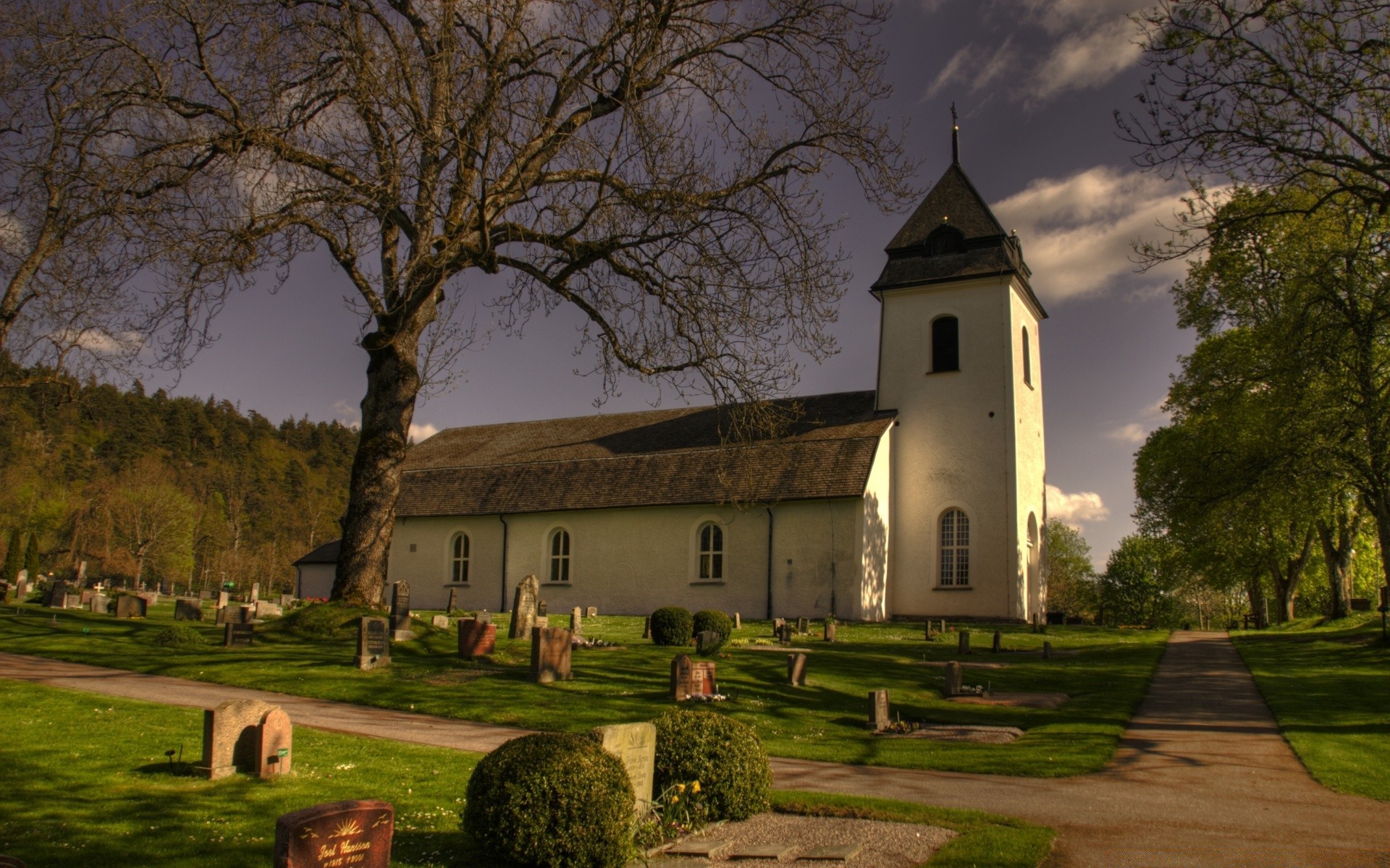 europe architecture tree church outdoors cemetery religion home travel building daylight house chapel sky