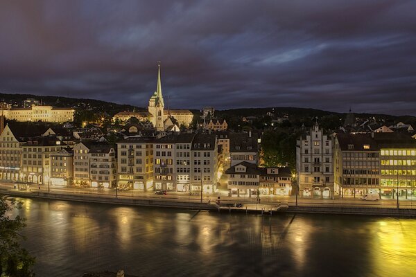 The river is like a mirror against the background of European architecture