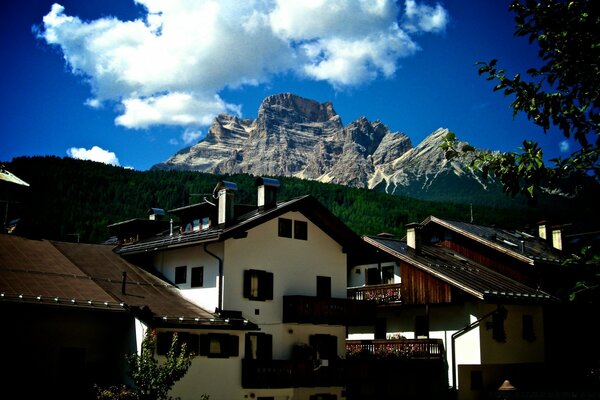 Settlement against the background of mountains and clouds