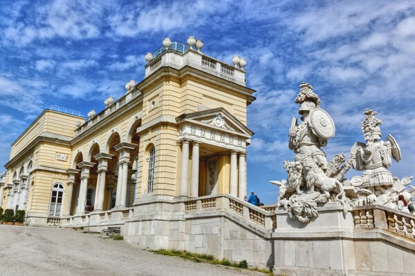 Beautiful architecture and statues against a blue sky background