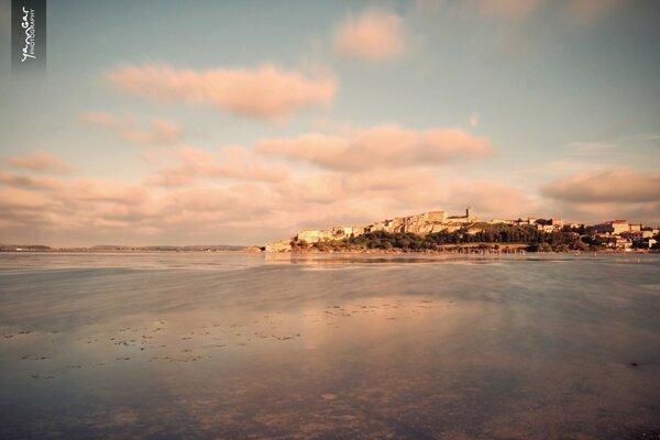 The seashore in the rays of sunset